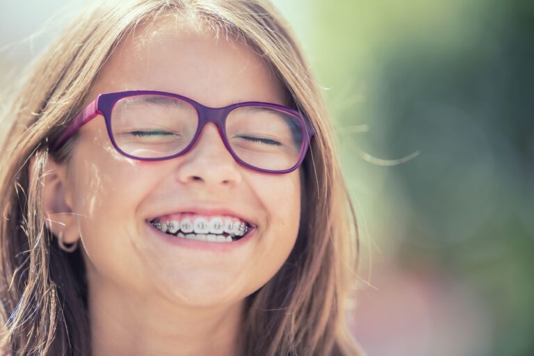 Young girl with purple glasses and braces